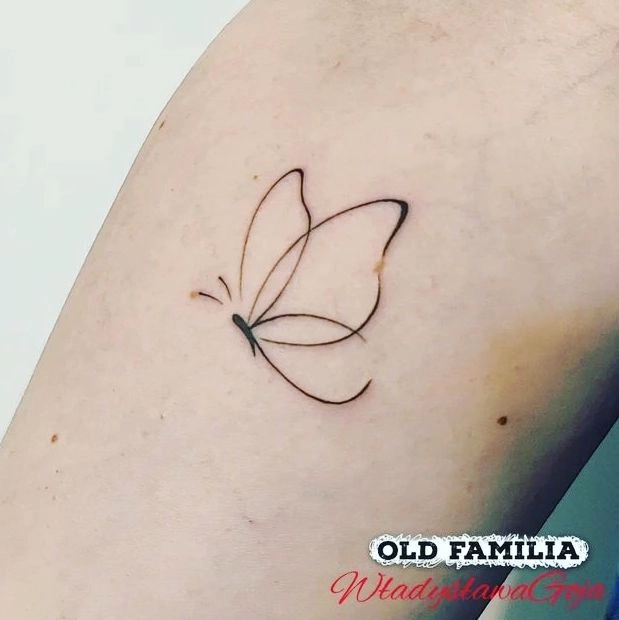 Minimalist Butterfly Outline Tattoo