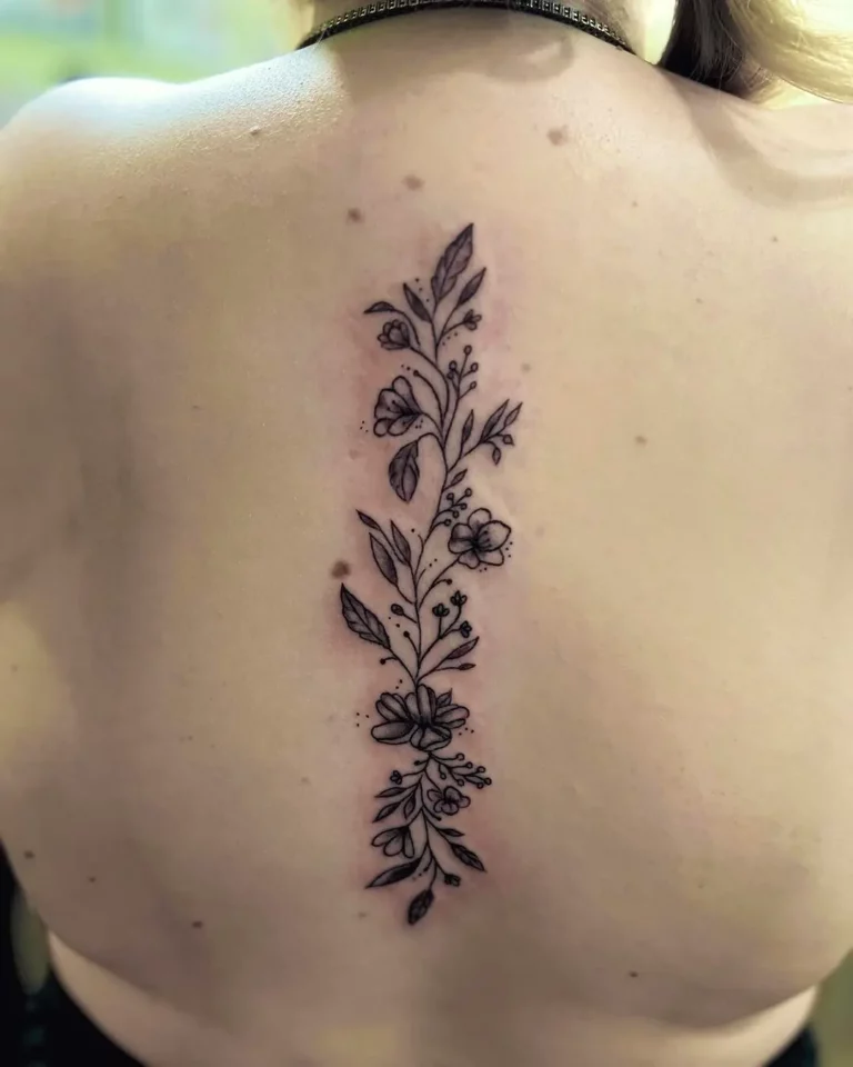 Energizing Floral Spine Tattoo