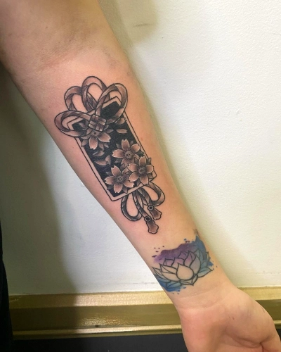Infinite Lotus Bloom Tattoo