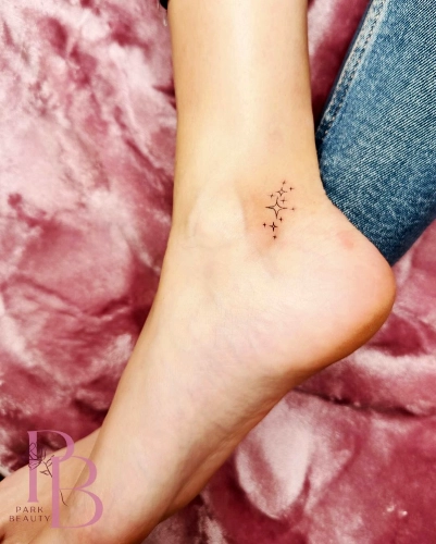 Minimalist Cross Constellation Ankle Tattoo