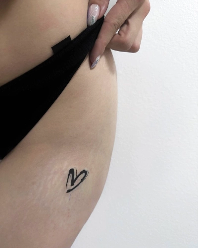 Minimalist Heartbeat Hip Tattoo