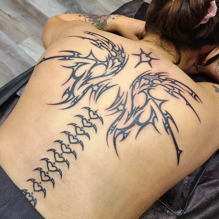 Phoenix Rebirth Spine Tattoo