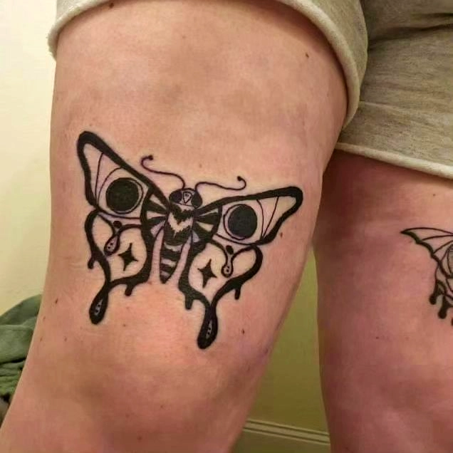 Enigmatic Moth Ink Drop Tattoo